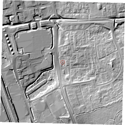 Shaded relief map of the ground around SG11TX, computed from Environment Agency LiDAR. The ground here sits at about 86 m above sea level and falls 15 m across the surrounding 800 m. Surface water reaching this point runs off ground lying to the north-east, 13.6 m higher.