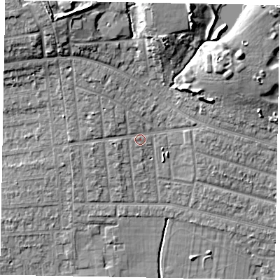 Shaded relief map of the ground around SL21NP, computed from Environment Agency LiDAR. The ground here sits at about 33 m above sea level and falls 13 m across the surrounding 800 m. Surface water reaching this point runs off ground lying to the west-north-west, 2.4 m higher.
