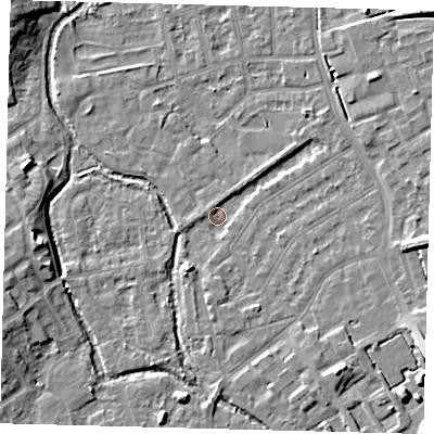 Shaded relief map of the ground around SM52AT, computed from Environment Agency LiDAR. The ground here sits at about 24 m above sea level and falls 9 m across the surrounding 800 m. Surface water reaching this point runs off ground lying to the south-east, 8.3 m higher.