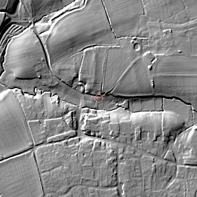 Shaded relief map of the ground around SN102QG, computed from Environment Agency LiDAR. The ground here sits at about 65 m above sea level and falls 16 m across the surrounding 800 m. Surface water reaching this point runs off ground lying to the east-north-east, 10.8 m higher.