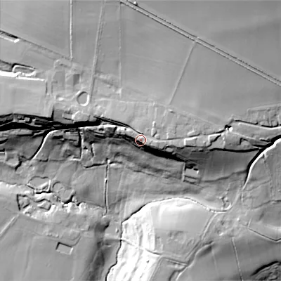 Shaded relief map of the ground around SN103JD, computed from Environment Agency LiDAR. The ground here sits at about 124 m above sea level and falls 60 m across the surrounding 800 m. Surface water reaching this point runs off ground lying to the east, 5.6 m higher.