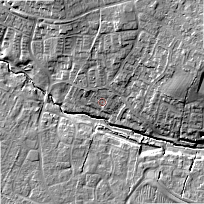 Shaded relief map of the ground around SN127DT, computed from Environment Agency LiDAR. The ground here sits at about 38 m above sea level and falls 15 m across the surrounding 800 m. Surface water reaching this point runs off ground lying to the north-north-east, 8.6 m higher.