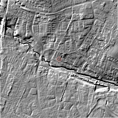 Shaded relief map of the ground around SN127JW, computed from Environment Agency LiDAR. The ground here sits at about 38 m above sea level and falls 15 m across the surrounding 800 m. Surface water reaching this point runs off ground lying to the north-north-east, 10.6 m higher.