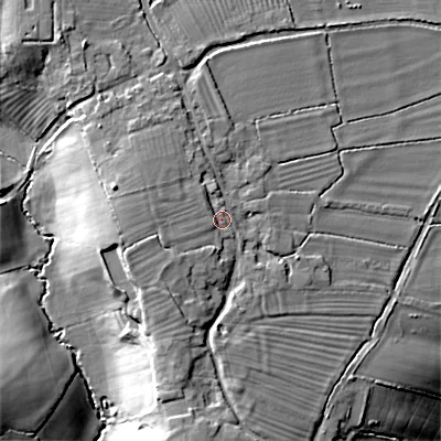 Shaded relief map of the ground around SN155EX, computed from Environment Agency LiDAR. The ground here sits at about 74 m above sea level and falls 21 m across the surrounding 800 m. Surface water reaching this point runs off ground lying to the west, 3.9 m higher.