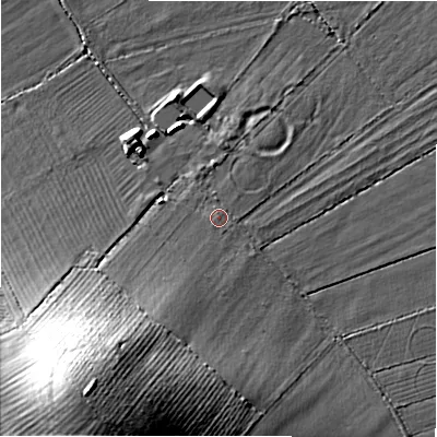 Shaded relief map of the ground around SN67QT, computed from Environment Agency LiDAR. The ground here sits at about 76 m above sea level and falls 25 m across the surrounding 800 m. Surface water reaching this point runs off ground lying to the south-south-west, 1.1 m higher.