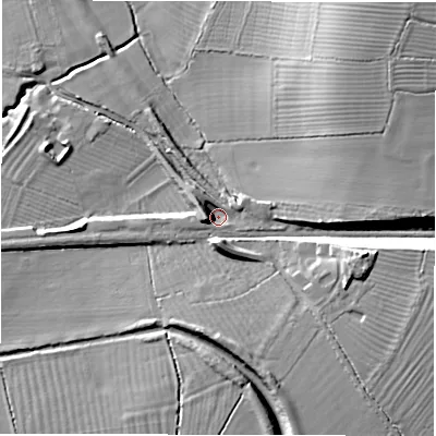 Shaded relief map of the ground around SN77QD, computed from Environment Agency LiDAR. The ground here sits at about 82 m above sea level and falls 17 m across the surrounding 800 m. Surface water reaching this point runs off ground lying to the west, 7.3 m higher.