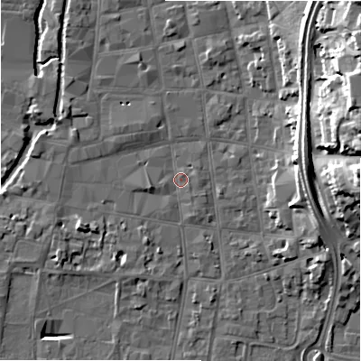 Shaded relief map of the ground around SP12DQ, computed from Environment Agency LiDAR. The ground here sits at about 46 m above sea level and falls 25 m across the surrounding 800 m. Surface water reaching this point runs off ground lying to the north-east, 21.6 m higher.