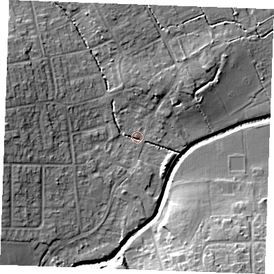 Shaded relief map of the ground around SS117HW, computed from Environment Agency LiDAR. The ground here sits at about 6 m above sea level and falls 14 m across the surrounding 800 m. Surface water reaching this point runs off ground lying to the west-north-west, 11.5 m higher.