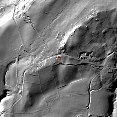Shaded relief map of the ground around ST102JE, computed from Environment Agency LiDAR. The ground here sits at about 216 m above sea level and falls 105 m across the surrounding 800 m. Surface water reaching this point runs off ground lying to the north-east, 23.4 m higher.
