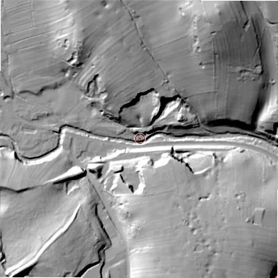 Shaded relief map of the ground around ST103JQ, computed from Environment Agency LiDAR. The ground here sits at about 210 m above sea level and falls 65 m across the surrounding 800 m. Surface water reaching this point runs off ground lying to the north-north-west, 39.7 m higher.