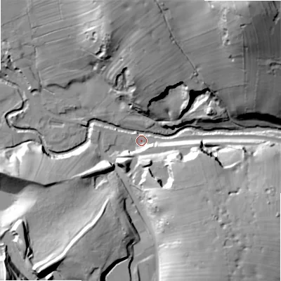 Shaded relief map of the ground around ST103JS, computed from Environment Agency LiDAR. The ground here sits at about 211 m above sea level and falls 65 m across the surrounding 800 m. Surface water reaching this point runs off ground lying to the north, 37.7 m higher.