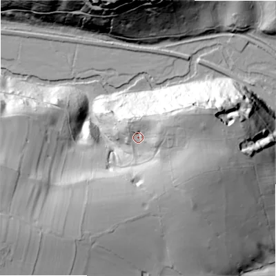 Shaded relief map of the ground around ST104DD, computed from Environment Agency LiDAR. The ground here sits at about 129 m above sea level and falls 64 m across the surrounding 800 m. Surface water reaching this point runs off ground lying to the east-north-east, 14.7 m higher.