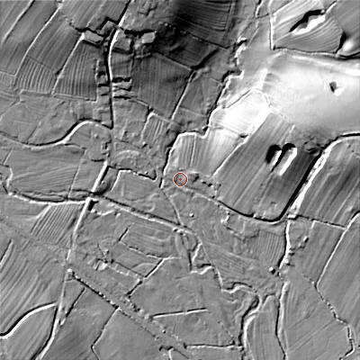 Shaded relief map of the ground around ST104SS, computed from Environment Agency LiDAR. The ground here sits at about 135 m above sea level and falls 22 m across the surrounding 800 m. Surface water reaching this point runs off ground lying to the east-north-east, 10.2 m higher.