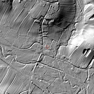 Shaded relief map of the ground around ST104ST, computed from Environment Agency LiDAR. The ground here sits at about 135 m above sea level and falls 23 m across the surrounding 800 m. Surface water reaching this point runs off ground lying to the north, 21.1 m higher.