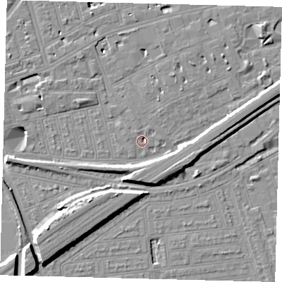 Shaded relief map of the ground around SW115AT, computed from Environment Agency LiDAR. The ground here sits at about 3 m above sea level and falls 11 m across the surrounding 800 m. Surface water reaching this point runs off ground lying to the north-north-east, 2.1 m higher.