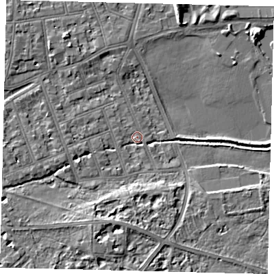 Shaded relief map of the ground around SW130BS, computed from Environment Agency LiDAR. The ground here sits at about 4 m above sea level and falls 7 m across the surrounding 800 m. Surface water reaching this point runs off ground lying to the south, 5.2 m higher.