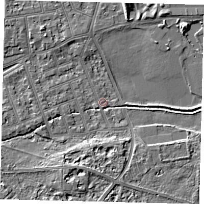 Shaded relief map of the ground around SW130BX, computed from Environment Agency LiDAR. The ground here sits at about 4 m above sea level and falls 7 m across the surrounding 800 m. Surface water reaching this point runs off ground lying to the south, 5.2 m higher.