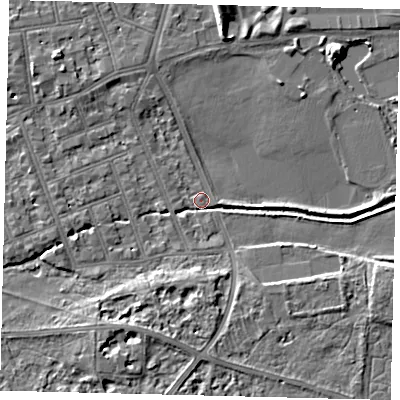 Shaded relief map of the ground around SW130DA, computed from Environment Agency LiDAR. The ground here sits at about 4 m above sea level and falls 7 m across the surrounding 800 m. Surface water reaching this point runs off ground lying to the south-south-west, 5.2 m higher.