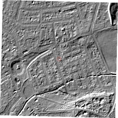 Shaded relief map of the ground around SW130DR, computed from Environment Agency LiDAR. The ground here sits at about 4 m above sea level and falls 7 m across the surrounding 800 m. Surface water reaching this point runs off ground lying to the north, 5.1 m higher.