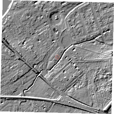 Shaded relief map of the ground around SW130LT, computed from Environment Agency LiDAR. The ground here sits at about 5 m above sea level and falls 12 m across the surrounding 800 m. Surface water reaching this point runs off ground lying to the south-east, 10.2 m higher.