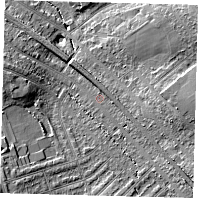 Shaded relief map of the ground around SW164JX, computed from Environment Agency LiDAR. The ground here sits at about 38 m above sea level and falls 16 m across the surrounding 800 m. Surface water reaching this point runs off ground lying to the south-east, 7.1 m higher.