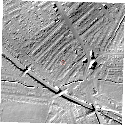 Shaded relief map of the ground around SW165JX, computed from Environment Agency LiDAR. The ground here sits at about 33 m above sea level and falls 20 m across the surrounding 800 m. Surface water reaching this point runs off ground lying to the north-north-east, 4.9 m higher.