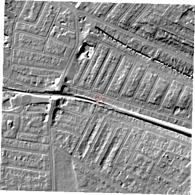 Shaded relief map of the ground around SW179ET, computed from Environment Agency LiDAR. The ground here sits at about 18 m above sea level and falls 18 m across the surrounding 800 m. Surface water reaching this point runs off ground lying to the east-south-east, 6.4 m higher.