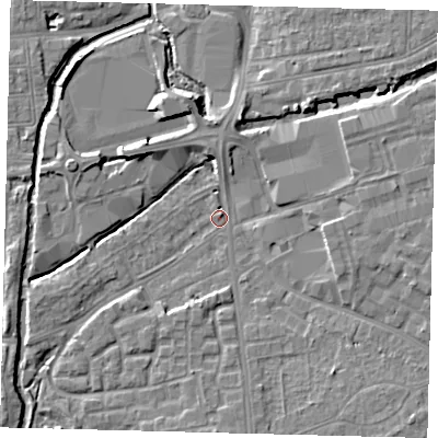 Shaded relief map of the ground around SW192FE, computed from Environment Agency LiDAR. The ground here sits at about 13 m above sea level and falls 6 m across the surrounding 800 m. Surface water reaching this point runs off ground lying to the south-east, 5.6 m higher.