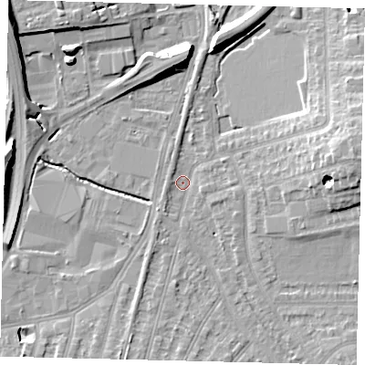 Shaded relief map of the ground around SW209AX, computed from Environment Agency LiDAR. The ground here sits at about 14 m above sea level and falls 13 m across the surrounding 800 m. Surface water reaching this point runs off ground lying to the east, 9.9 m higher.