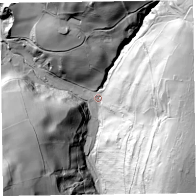 Shaded relief map of the ground around SY107HY, computed from Environment Agency LiDAR. The ground here sits at about 216 m above sea level and falls 128 m across the surrounding 800 m. Surface water reaching this point runs off ground lying to the east, 104.2 m higher.