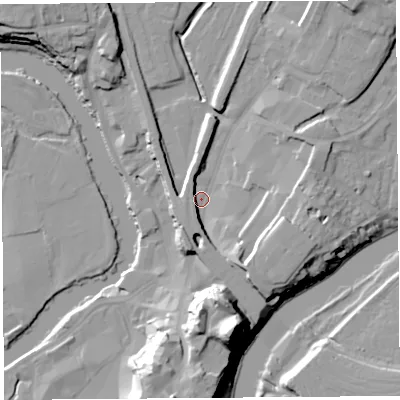 Shaded relief map of the ground around SY12EE, computed from Environment Agency LiDAR. The ground here sits at about 53 m above sea level and falls 33 m across the surrounding 800 m. Surface water reaching this point runs off ground lying to the south-east, 10.3 m higher.