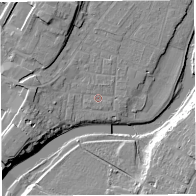 Shaded relief map of the ground around SY12JL, computed from Environment Agency LiDAR. The ground here sits at about 52 m above sea level and falls 17 m across the surrounding 800 m. Surface water reaching this point runs off ground lying to the west, 7.6 m higher.