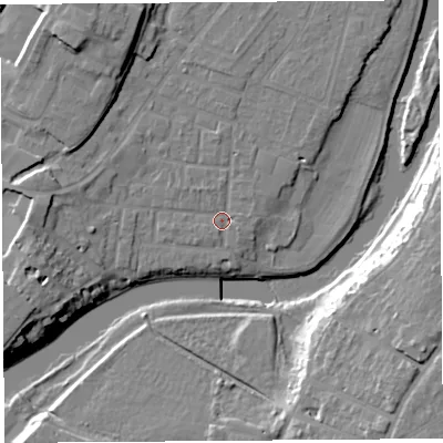 Shaded relief map of the ground around SY12JP, computed from Environment Agency LiDAR. The ground here sits at about 52 m above sea level and falls 18 m across the surrounding 800 m. Surface water reaching this point runs off ground lying to the west, 8.5 m higher.