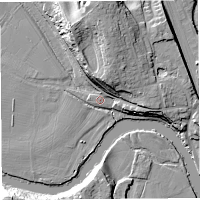 Shaded relief map of the ground around SY12LT, computed from Environment Agency LiDAR. The ground here sits at about 52 m above sea level and falls 24 m across the surrounding 800 m. Surface water reaching this point runs off ground lying to the north, 20.2 m higher.