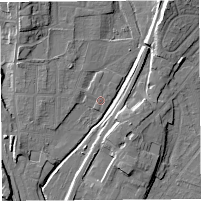 Shaded relief map of the ground around SY12RG, computed from Environment Agency LiDAR. The ground here sits at about 53 m above sea level and falls 16 m across the surrounding 800 m. Surface water reaching this point runs off ground lying to the north-west, 1.1 m higher.