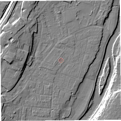 Shaded relief map of the ground around SY12SL, computed from Environment Agency LiDAR. The ground here sits at about 52 m above sea level and falls 16 m across the surrounding 800 m. Surface water reaching this point runs off ground lying to the west-south-west, 0.9 m higher.