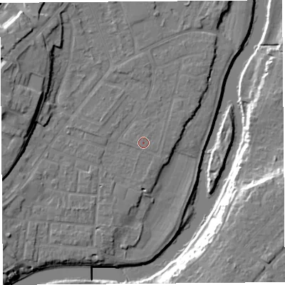 Shaded relief map of the ground around SY12TU, computed from Environment Agency LiDAR. The ground here sits at about 52 m above sea level and falls 17 m across the surrounding 800 m. The ground contributing surface water to this point lies to the west-south-west.