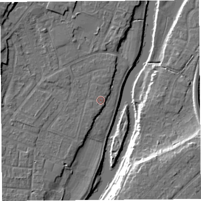 Shaded relief map of the ground around SY12UE, computed from Environment Agency LiDAR. The ground here sits at about 52 m above sea level and falls 16 m across the surrounding 800 m. Surface water reaching this point runs off ground lying to the north-north-west, 1.0 m higher.