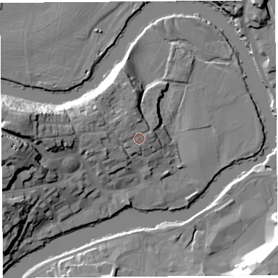 Shaded relief map of the ground around SY38QL, computed from Environment Agency LiDAR. The ground here sits at about 57 m above sea level and falls 25 m across the surrounding 800 m. Surface water reaching this point runs off ground lying to the north-west, 2.4 m higher.