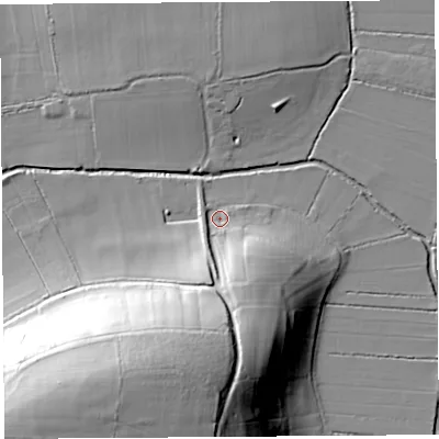 Shaded relief map of the ground around TA116JD, computed from Environment Agency LiDAR. The ground here sits at about 12 m above sea level and falls 54 m across the surrounding 800 m. Surface water reaching this point runs off ground lying to the south-south-west, 48.9 m higher.