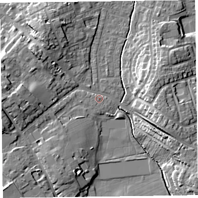 Shaded relief map of the ground around TA12EY, computed from Environment Agency LiDAR. The ground here sits at about 18 m above sea level and falls 15 m across the surrounding 800 m. Surface water reaching this point runs off ground lying to the west, 10.9 m higher.