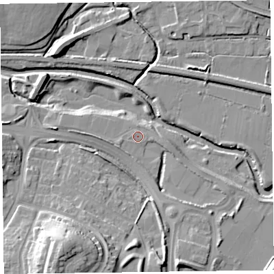 Shaded relief map of the ground around TA12LP, computed from Environment Agency LiDAR. The ground here sits at about 12 m above sea level and falls 23 m across the surrounding 800 m. Surface water reaching this point runs off ground lying to the east-south-east, 1.0 m higher.