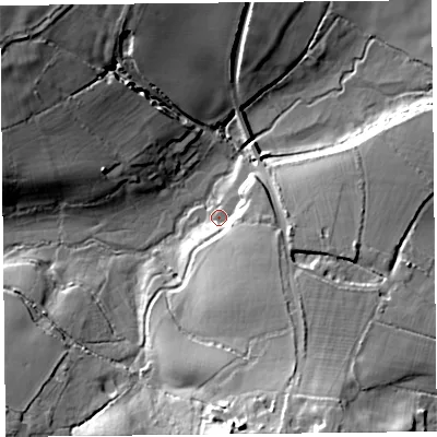 Shaded relief map of the ground around TA203AQ, computed from Environment Agency LiDAR. The ground here sits at about 69 m above sea level and falls 35 m across the surrounding 800 m. Surface water reaching this point runs off ground lying to the south-south-east, 12.6 m higher.