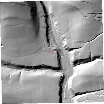 Shaded relief map of the ground around TA210HS, computed from Environment Agency LiDAR. The ground here sits at about 121 m above sea level and falls 85 m across the surrounding 800 m. Surface water reaching this point runs off ground lying to the north-west, 63.8 m higher.