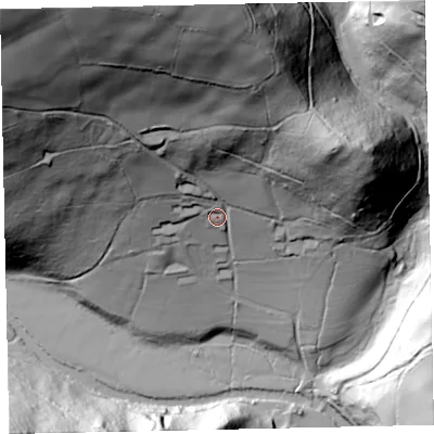 Shaded relief map of the ground around TA229QF, computed from Environment Agency LiDAR. The ground here sits at about 184 m above sea level and falls 148 m across the surrounding 800 m. Surface water reaching this point runs off ground lying to the north, 100.4 m higher.