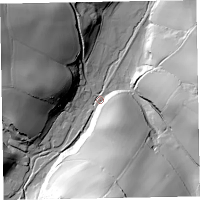Shaded relief map of the ground around TA230RQ, computed from Environment Agency LiDAR. The ground here sits at about 61 m above sea level and falls 75 m across the surrounding 800 m. Surface water reaching this point runs off ground lying to the south, 69.9 m higher.