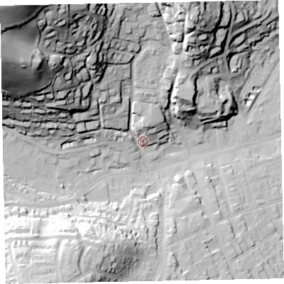 Shaded relief map of the ground around TA245NX, computed from Environment Agency LiDAR. The ground here sits at about 21 m above sea level and falls 92 m across the surrounding 800 m. Surface water reaching this point runs off ground lying to the north-west, 83.8 m higher.