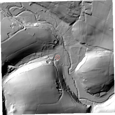 Shaded relief map of the ground around TA247LY, computed from Environment Agency LiDAR. The ground here sits at about 250 m above sea level and falls 60 m across the surrounding 800 m. Surface water reaching this point runs off ground lying to the south-west, 52.3 m higher.