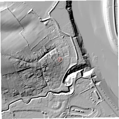 Shaded relief map of the ground around TA52RE, computed from Environment Agency LiDAR. The ground here sits at about 10 m above sea level and falls 32 m across the surrounding 800 m. Surface water reaching this point runs off ground lying to the west, 7.7 m higher.