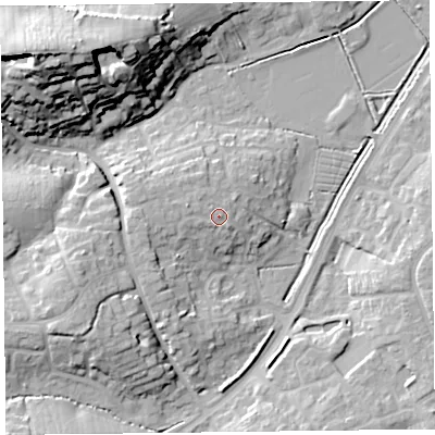 Shaded relief map of the ground around TA63UN, computed from Environment Agency LiDAR. The ground here sits at about 12 m above sea level and falls 31 m across the surrounding 800 m. Surface water reaching this point runs off ground lying to the west, 1.8 m higher.